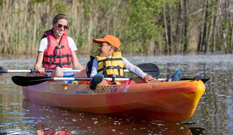 two people kayaking on lake michigan