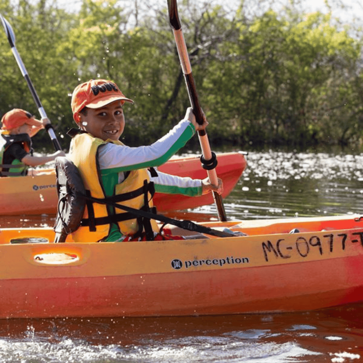 child kayaking
