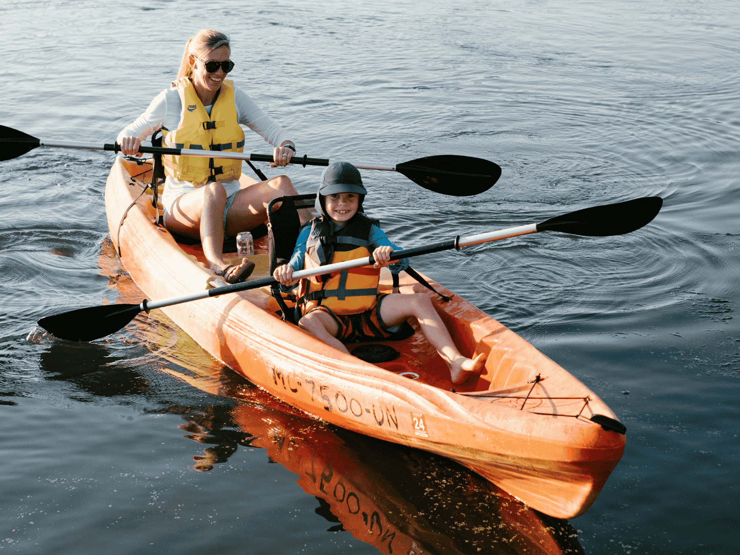 mother and child in a double kayak